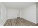 Bright bedroom featuring wood-look flooring, neutral walls, and plantation shutters at 374 Pomona Ct, Greenfield, IN 46140
