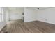 Dining area with wood-look floors, modern chandelier, and access to the kitchen at 374 Pomona Ct, Greenfield, IN 46140
