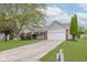 Charming single-story home with a well-manicured lawn and attached two-car garage at 374 Pomona Ct, Greenfield, IN 46140