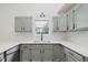 Bright kitchen featuring gray cabinets, white countertops, and subway tile backsplash at 374 Pomona Ct, Greenfield, IN 46140
