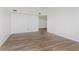 Spacious living room with wood-look flooring, neutral walls, and natural light at 374 Pomona Ct, Greenfield, IN 46140