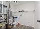 Utility room with shelving, water heater, and filtration system at 374 Pomona Ct, Greenfield, IN 46140
