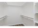 Bright walk-in closet with built-in shelving and wood-style flooring at 374 Pomona Ct, Greenfield, IN 46140