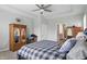 Bright bedroom features a tray ceiling, neutral walls, and furniture with mirrored doors at 395 Ehrlich Ln, Westfield, IN 46074