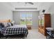 Bright bedroom features a large window, tray ceiling and an armoire with mirrored doors at 395 Ehrlich Ln, Westfield, IN 46074