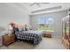 Bright bedroom features a large window, tray ceiling, and a neutral color palette at 395 Ehrlich Ln, Westfield, IN 46074