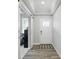 Bright entryway featuring hardwood floors, a sliding barn door, and a front door with glass paneling at 395 Ehrlich Ln, Westfield, IN 46074