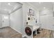 Inviting foyer with wood floors, storage bench, and white trim at 395 Ehrlich Ln, Westfield, IN 46074