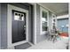 The cozy front porch has outdoor seating and offers a welcoming entrance to the home at 395 Ehrlich Ln, Westfield, IN 46074