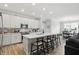 Bright kitchen island with barstool seating overlooks stainless appliances and ample cabinet space at 395 Ehrlich Ln, Westfield, IN 46074