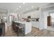Bright eat-in kitchen island with seating overlooks stainless appliances and white cabinets at 395 Ehrlich Ln, Westfield, IN 46074