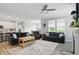 The spacious living room features hardwood floors and is open to the modern kitchen and dining area at 395 Ehrlich Ln, Westfield, IN 46074