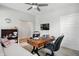 Home office featuring a large desk, comfortable chair, and TV, with easy access to the rest of the house at 395 Ehrlich Ln, Westfield, IN 46074