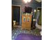 Bedroom with wood armoire and decorative accents; includes a view of the adjacent bathroom at 409 W 3Rd St, Alexandria, IN 46001