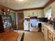 Well-lit kitchen with a dining table and essential appliances, providing a comfortable cooking and dining experience at 409 W 3Rd St, Alexandria, IN 46001