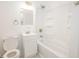 Cozy bathroom features a combined shower and tub, white vanity, and stylish fixtures at 412 S Norfolk St, Indianapolis, IN 46241