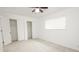 Sun-filled bedroom featuring white walls, carpet, a window, and a double closet at 412 S Norfolk St, Indianapolis, IN 46241