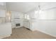 Well-lit white kitchen features new appliances, and laminate floors, perfect for cooking at 412 S Norfolk St, Indianapolis, IN 46241