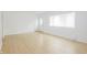 Clean and bright living room boasts laminate floors, offering a blank canvas at 412 S Norfolk St, Indianapolis, IN 46241