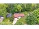 Aerial view of a well-maintained home with red roof, surrounded by lush greenery, showcases the property's curb appeal at 434 Verwood Ct, Indianapolis, IN 46234