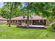 Charming brick home with a cozy wooden deck and gazebo in the backyard, perfect for outdoor gatherings at 434 Verwood Ct, Indianapolis, IN 46234