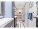 Remodeled bathroom features a modern vanity, walk-in shower, and neutral tiling at 434 Verwood Ct, Indianapolis, IN 46234