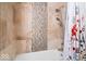 Bathroom featuring a shower with neutral-colored tiling and a bathtub with patterned curtain at 434 Verwood Ct, Indianapolis, IN 46234