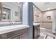Remodeled bathroom features updated cabinets, sink, walk-in shower, and fixtures at 434 Verwood Ct, Indianapolis, IN 46234