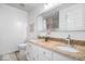 Bathroom featuring a double vanity with granite countertops and a large mirror at 434 Verwood Ct, Indianapolis, IN 46234