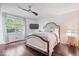 Bedroom featuring natural lighting, TV, ceiling fan, and a comfortable bed at 434 Verwood Ct, Indianapolis, IN 46234