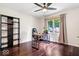 Bedroom with hardwood floors, modern ceiling fan, and bright natural light at 434 Verwood Ct, Indianapolis, IN 46234