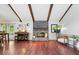Bright living room featuring high ceilings, wood beams, fireplace and hardwood floors at 434 Verwood Ct, Indianapolis, IN 46234