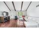 Bright living room featuring high ceilings, wood beams, fireplace and hardwood floors at 434 Verwood Ct, Indianapolis, IN 46234
