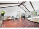 Bright living room featuring high ceilings, wood beams, fireplace and hardwood floors at 434 Verwood Ct, Indianapolis, IN 46234