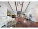 Bright living room featuring high ceilings, wood beams, fireplace and hardwood floors at 434 Verwood Ct, Indianapolis, IN 46234