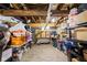 Unfinished basement with exposed wooden beams and organized storage shelves, offering potential for customization at 4414 Winthrop Ave, Indianapolis, IN 46205