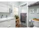 Light and airy bathroom featuring modern fixtures, white vanity with storage, and stylish decor at 4414 Winthrop Ave, Indianapolis, IN 46205