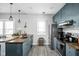 Modern kitchen with stainless steel appliances, unique cabinetry, and a butcher block countertop at 4414 Winthrop Ave, Indianapolis, IN 46205