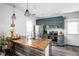 Modern kitchen with butcher block countertop, stainless steel appliances, and unique cabinetry at 4414 Winthrop Ave, Indianapolis, IN 46205
