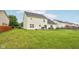 Backyard of a two story home, with a patio, furniture and a grill at 4434 W Windsong Ct, New Palestine, IN 46163