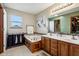 Bright bathroom with a vanity, bathtub and bright natural light at 4434 W Windsong Ct, New Palestine, IN 46163