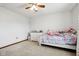 Bright bedroom featuring carpet, ceiling fan, and a white dresser with decor at 4434 W Windsong Ct, New Palestine, IN 46163