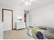 Bedroom with light carpet, a full sized bed, and a white dresser at 4434 W Windsong Ct, New Palestine, IN 46163