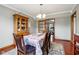 Dining room features hardwood floors, elegant decor, and natural lighting at 4434 W Windsong Ct, New Palestine, IN 46163