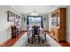 Formal dining room features hardwood floors, elegant decor, and natural lighting at 4434 W Windsong Ct, New Palestine, IN 46163