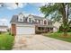 Well-maintained home with a two-car garage and a spacious front yard at 4434 W Windsong Ct, New Palestine, IN 46163