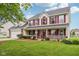 Lovely home with a spacious front porch and well-maintained landscaping at 4434 W Windsong Ct, New Palestine, IN 46163