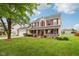 Attractive home with a covered porch, offering a welcoming curb appeal at 4434 W Windsong Ct, New Palestine, IN 46163