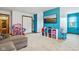 Recreation room with colorful walls, large closets, tv and bright natural light at 4434 W Windsong Ct, New Palestine, IN 46163