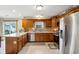 Spacious kitchen with stainless steel appliances and ample counter space at 4434 W Windsong Ct, New Palestine, IN 46163